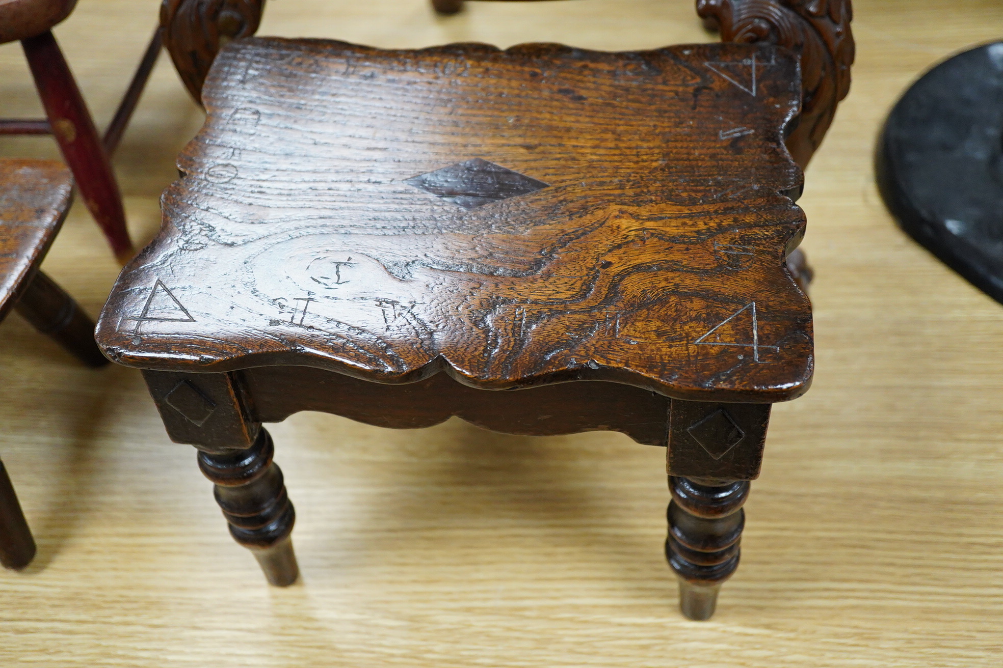 Two antique wooden stools and two children's chairs, one with arms and an upholstered seat x 51cm high